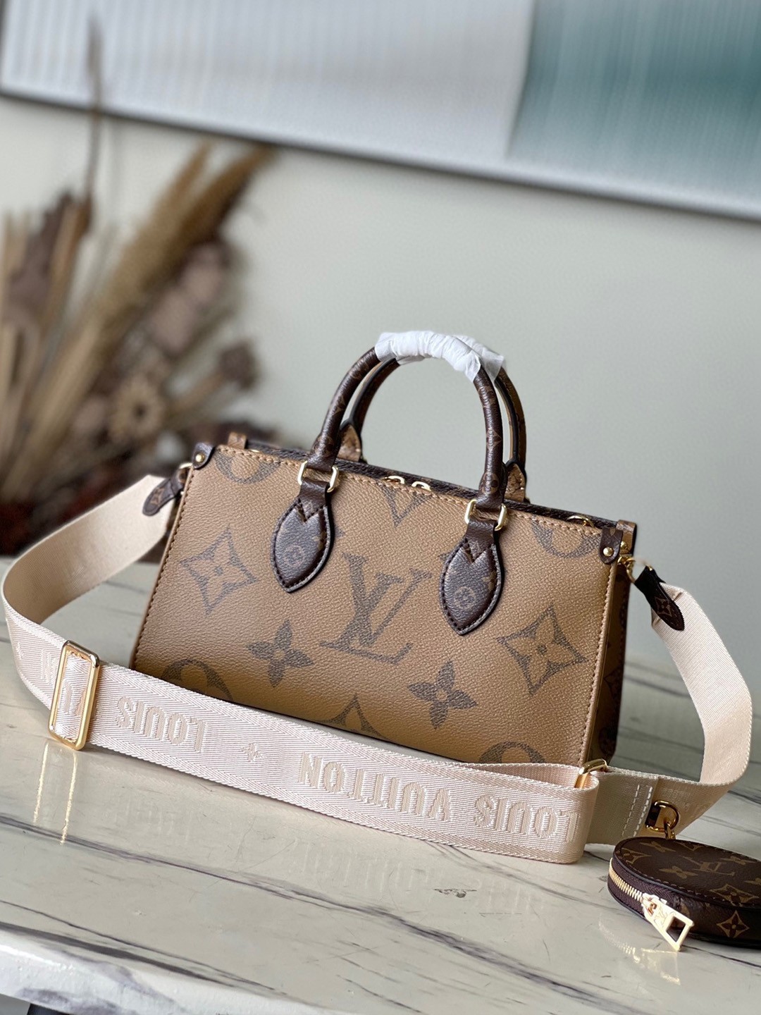 LV OnTheGo East West Bag In Monogram Reverse Canvas M46653