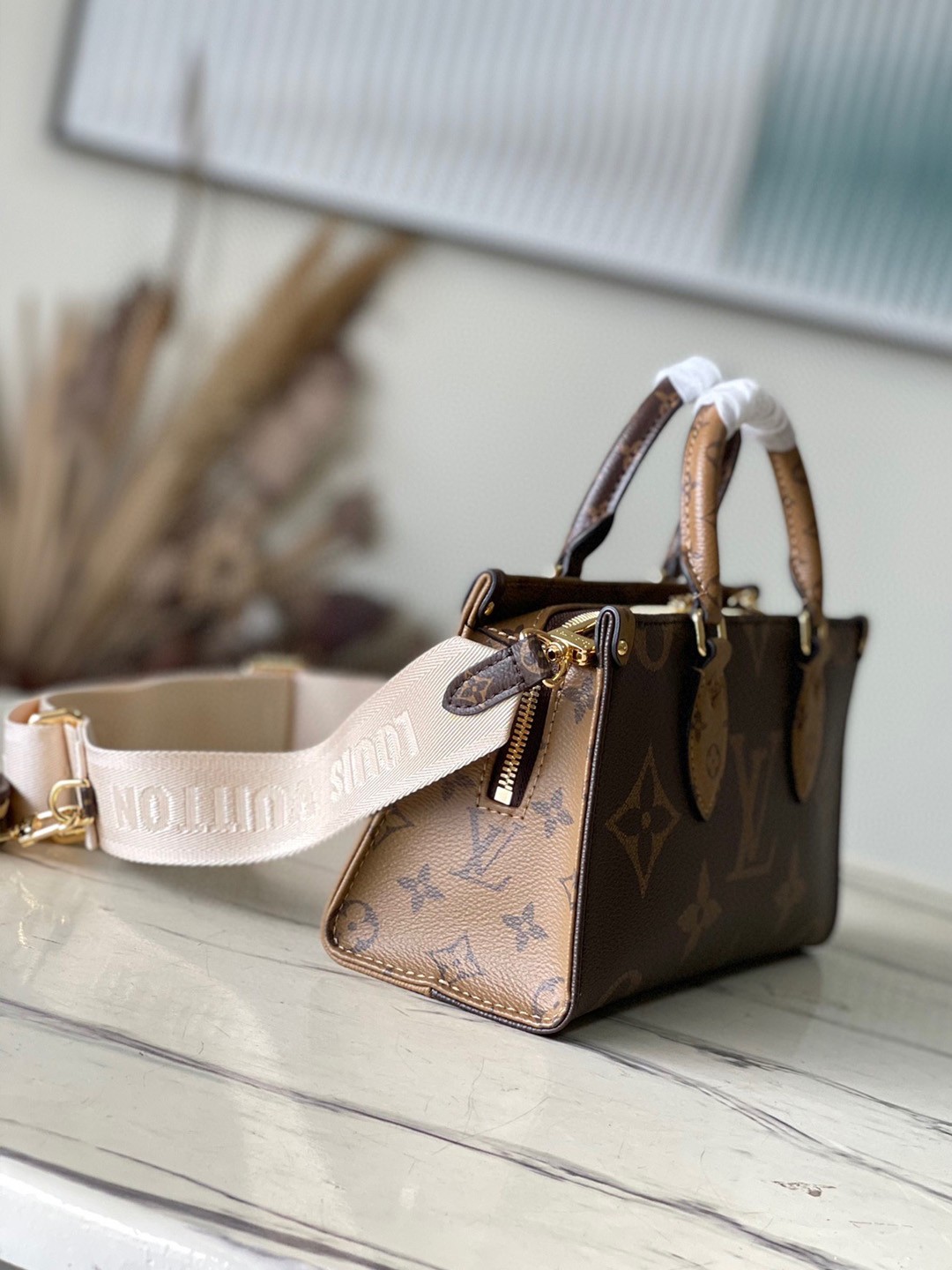 LV OnTheGo East West Bag In Monogram Reverse Canvas M46653