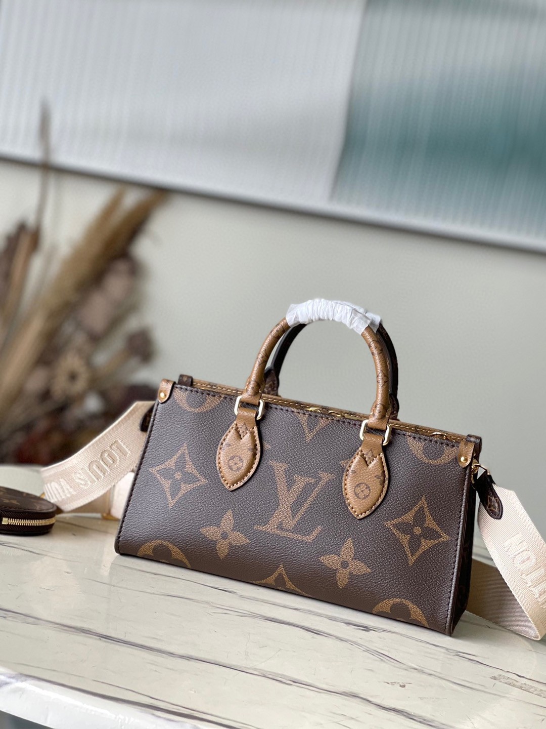 LV OnTheGo East West Bag In Monogram Reverse Canvas M46653