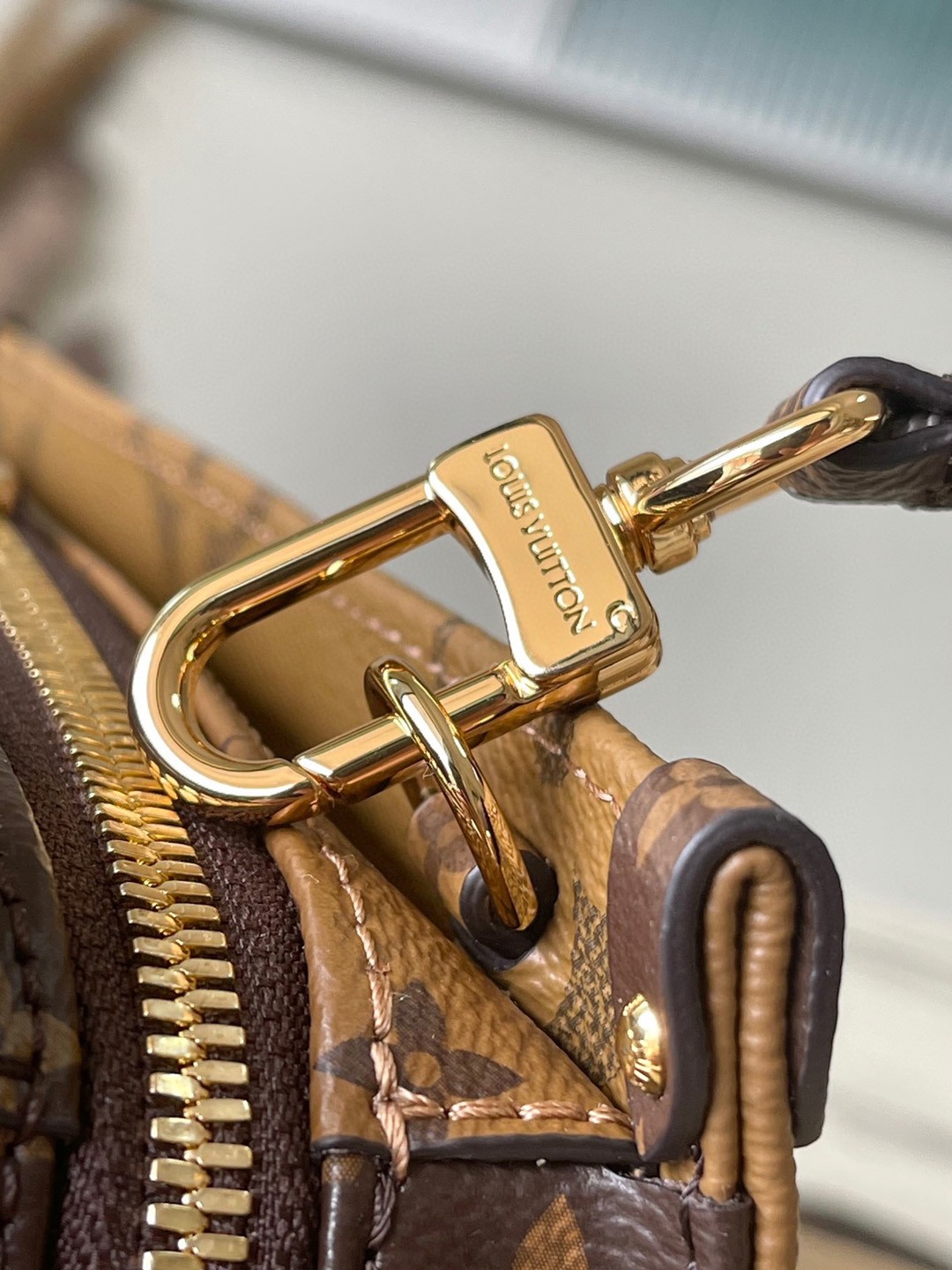 LV OnTheGo East West Bag In Monogram Reverse Canvas M46653