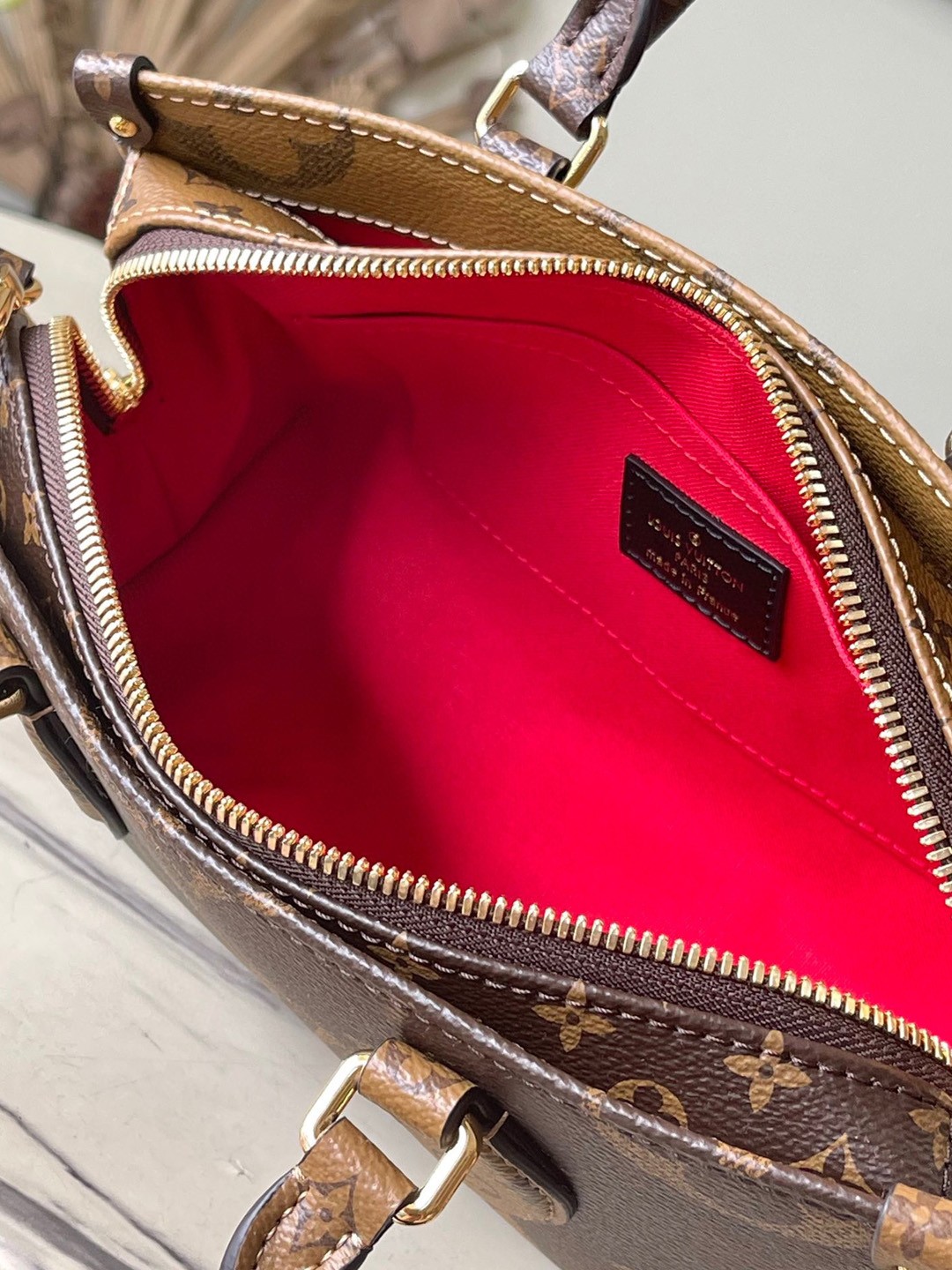 LV OnTheGo East West Bag In Monogram Reverse Canvas M46653