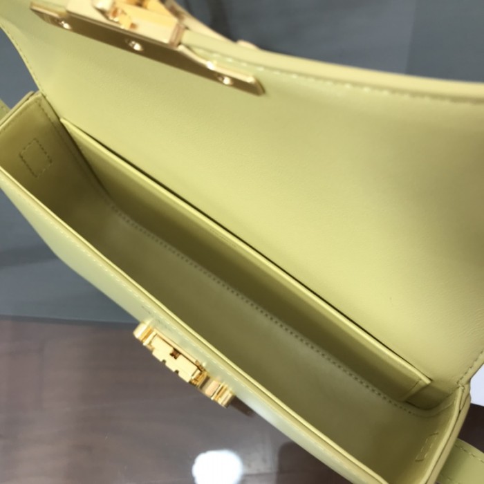 Ce**e shoulder bag triomphe in shiny calfskin yellow