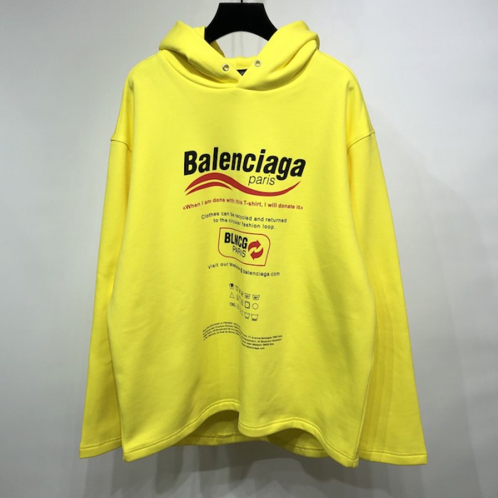 Ba*len*cia*ga dry cleaning hooded t-shirt in yellow