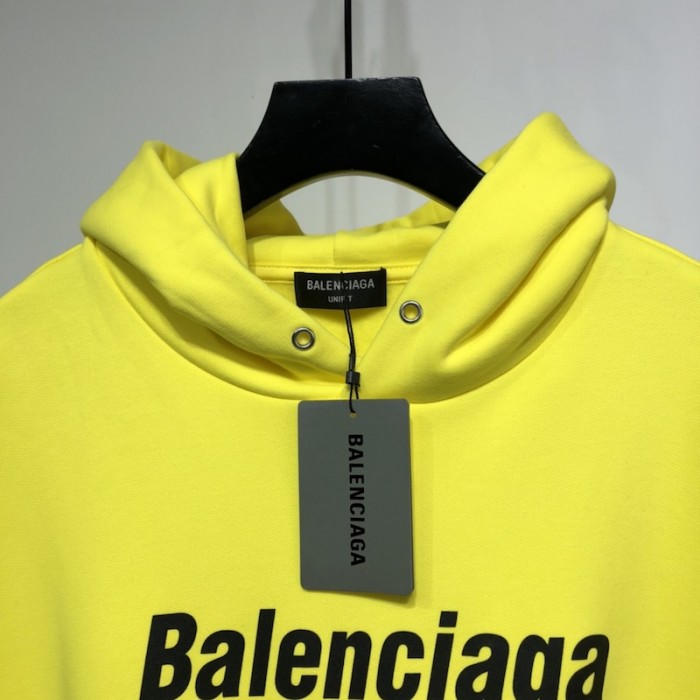 Ba*len*cia*ga dry cleaning hooded t-shirt in yellow