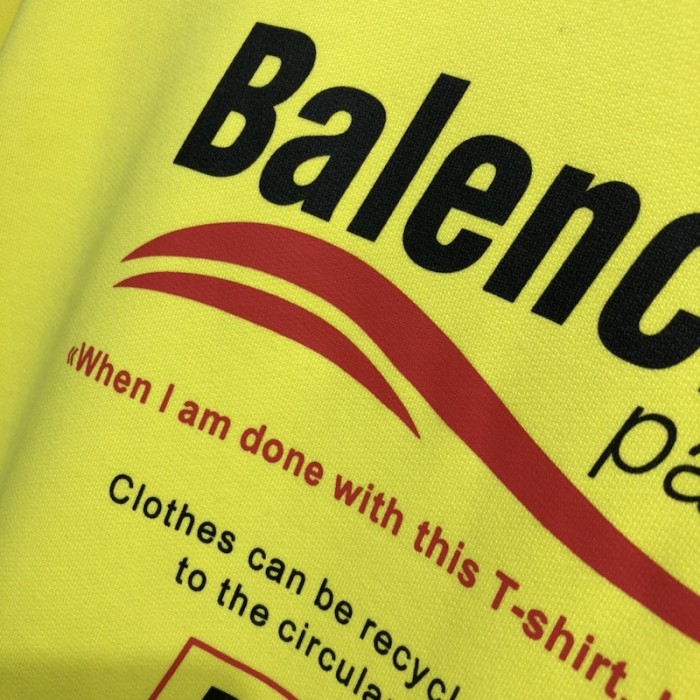 Ba*len*cia*ga dry cleaning hooded t-shirt in yellow
