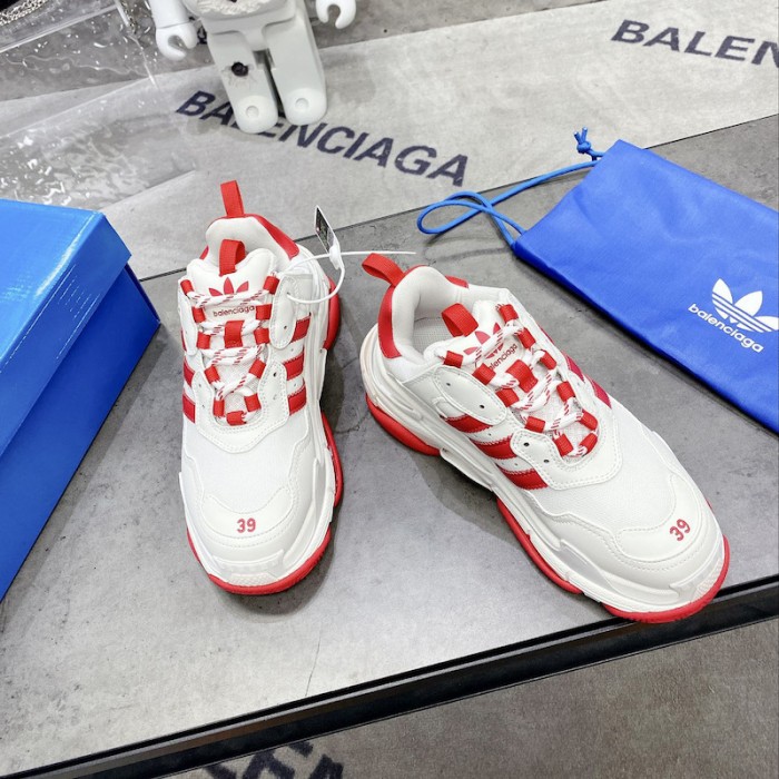 Ba*len*cia*ga / ad*s triple s sneaker in red