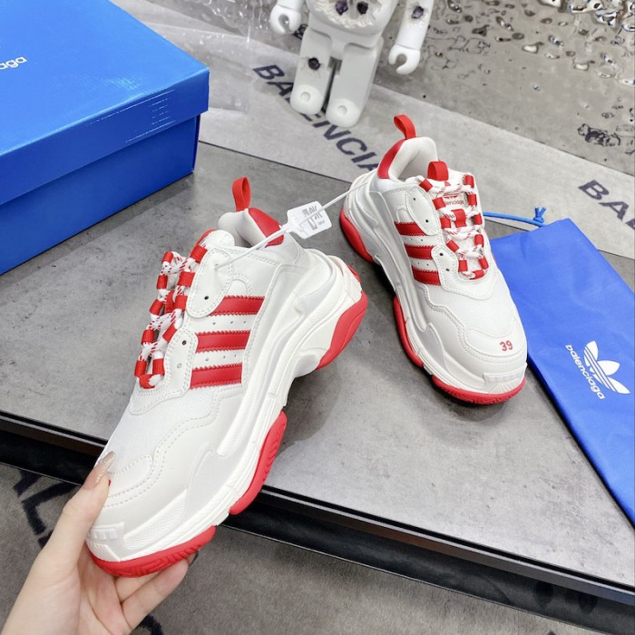 Ba*len*cia*ga / ad*s triple s sneaker in red