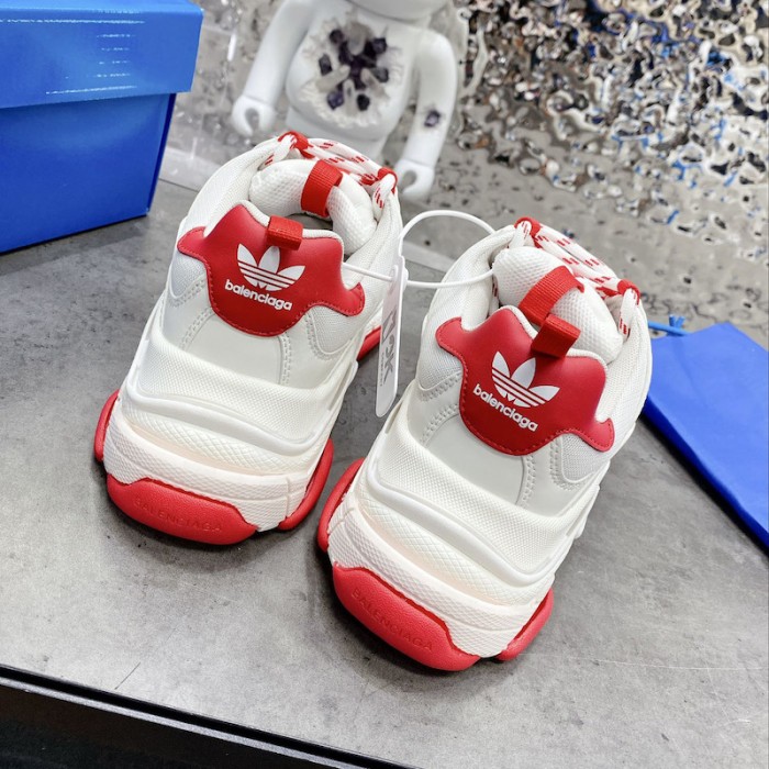 Ba*len*cia*ga / ad*s triple s sneaker in red