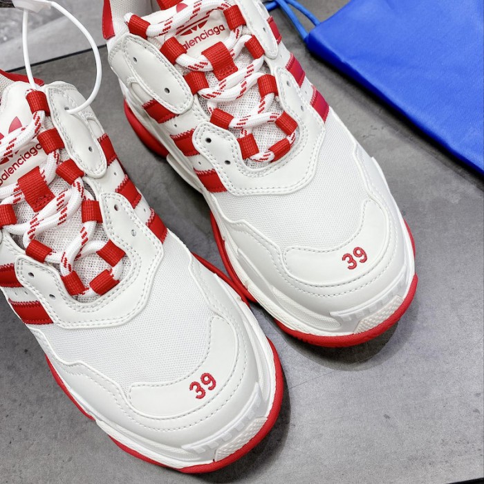 Ba*len*cia*ga / ad*s triple s sneaker in red