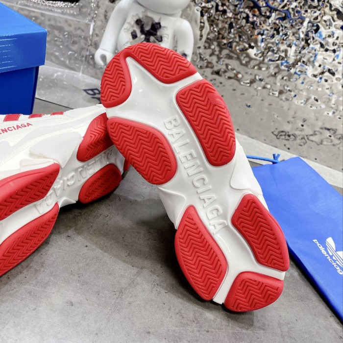 Ba*len*cia*ga / ad*s triple s sneaker in red