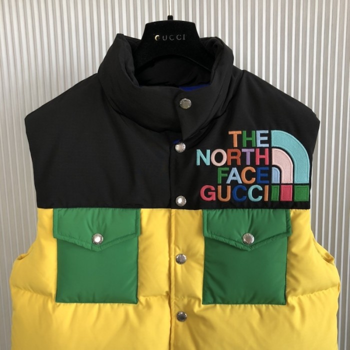the north face x G*u*i down vest yellow