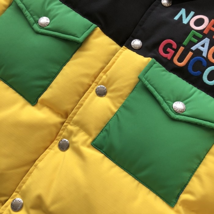 the north face x G*u*i down vest yellow