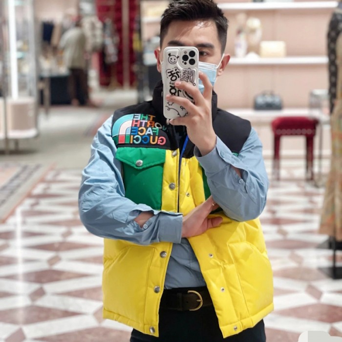 the north face x G*u*i down vest yellow