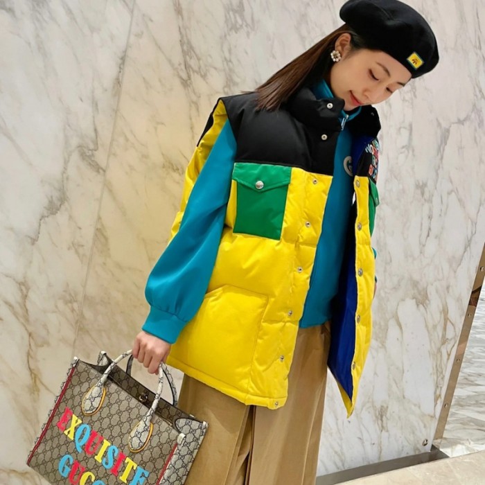 the north face x G*u*i down vest yellow