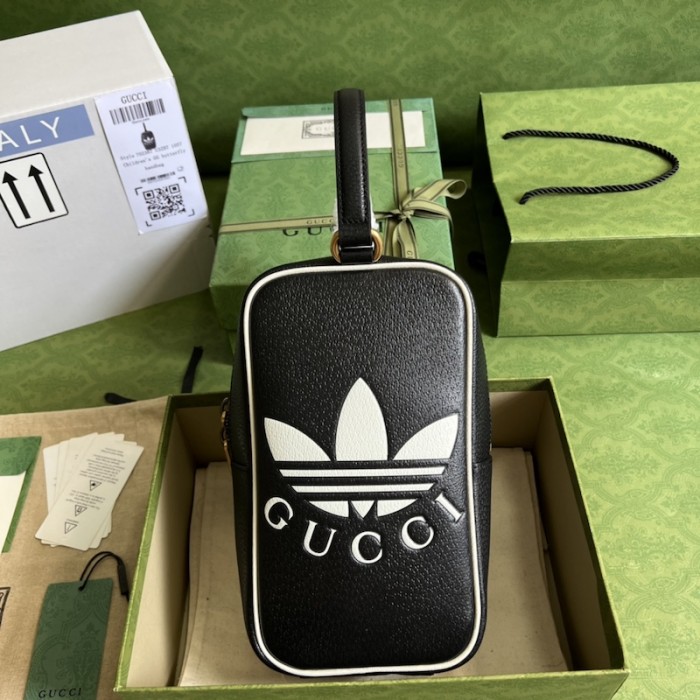 Ad*s x g*u*i mini top handle bag black
