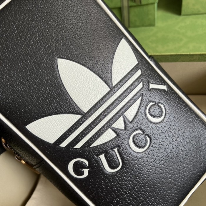 Ad*s x g*u*i mini top handle bag black
