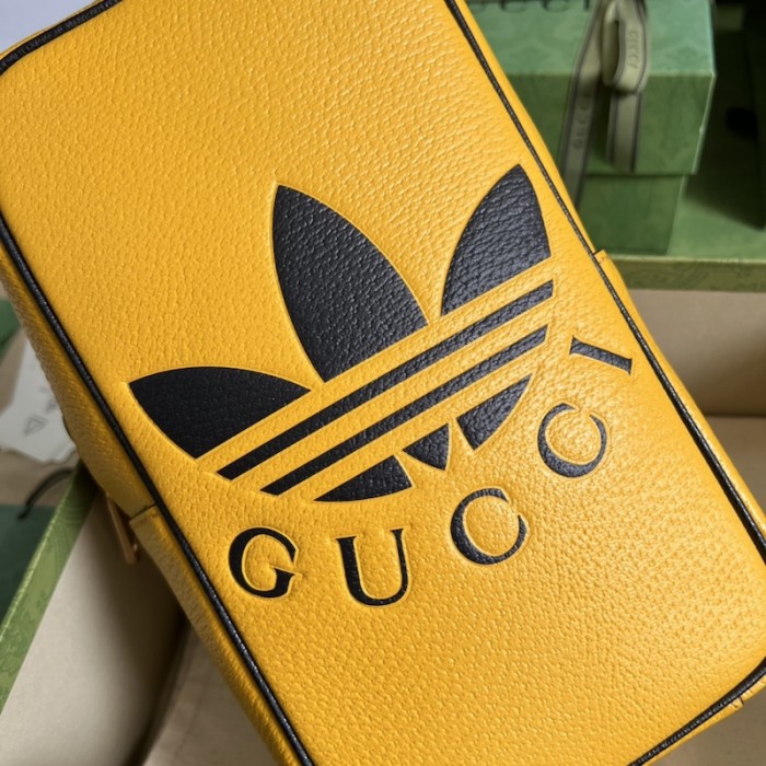 Ad*s x g*u*i mini top handle bag yellow