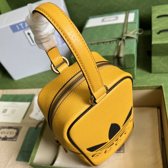 Ad*s x g*u*i mini top handle bag yellow