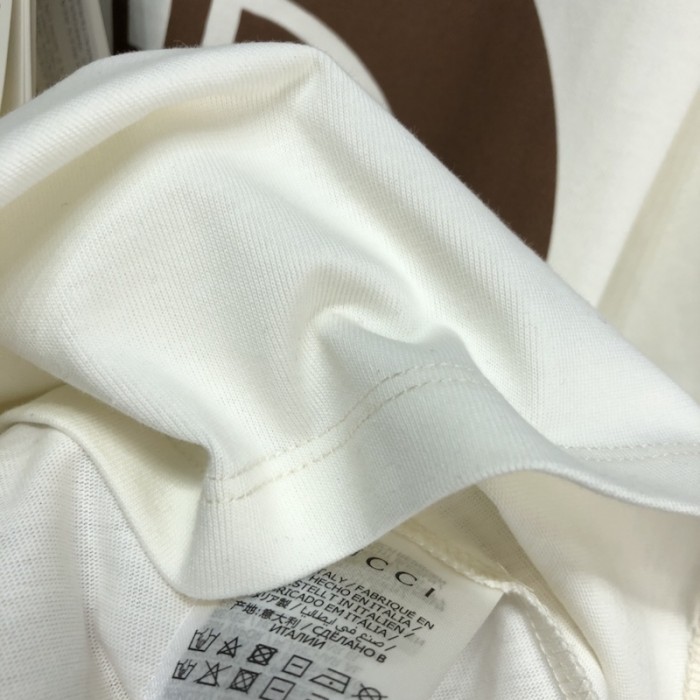 G*u*i x the north face t shirt cream