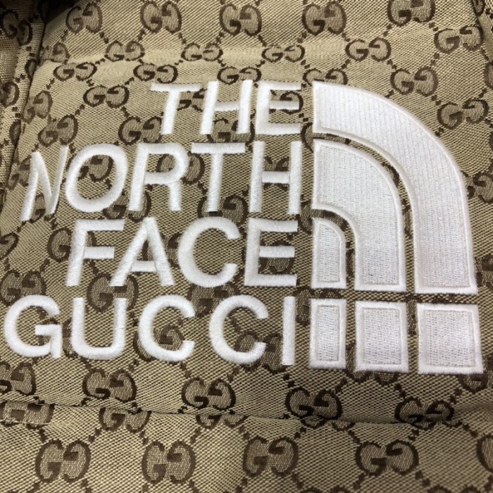G*u*i x the north face print jacket beige