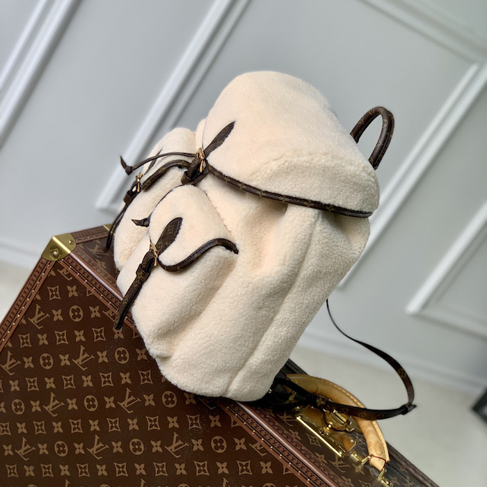 l**is V*t*n monogram shearling backpack m23384
