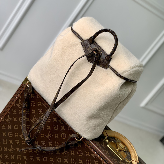 l**is V*t*n monogram shearling backpack m23384