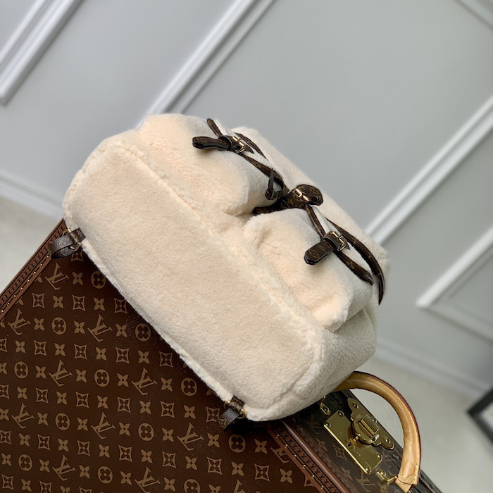 l**is V*t*n monogram shearling backpack m23384