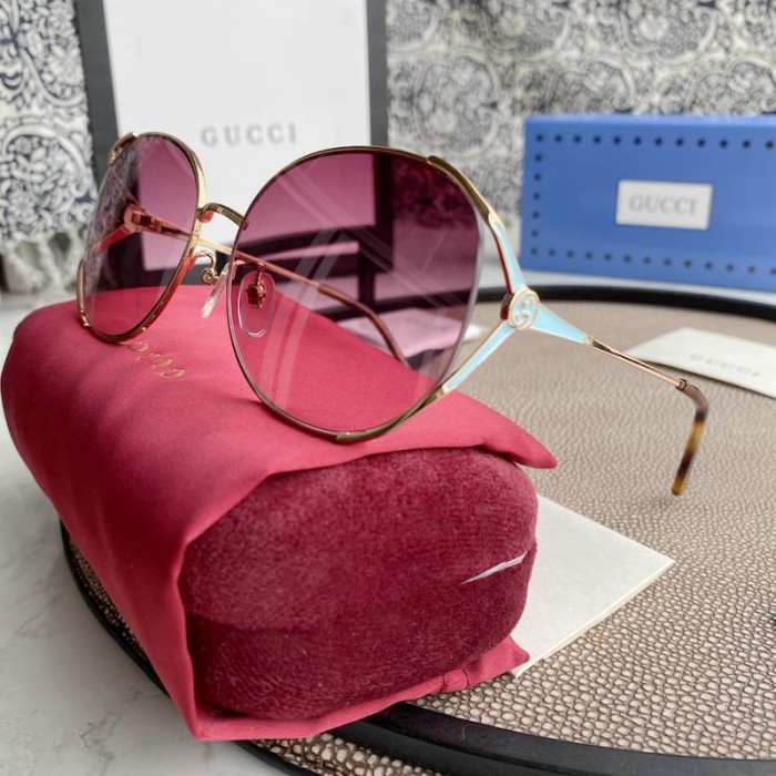 G*u*i oval metal sunglasses blue