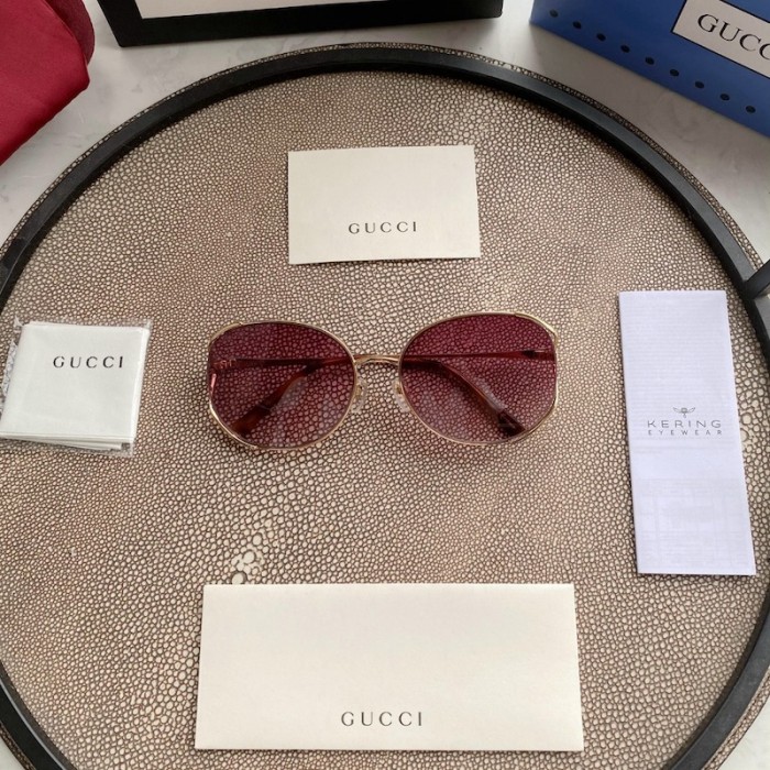 G*u*i oval metal sunglasses blue