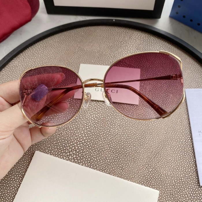 G*u*i oval metal sunglasses blue