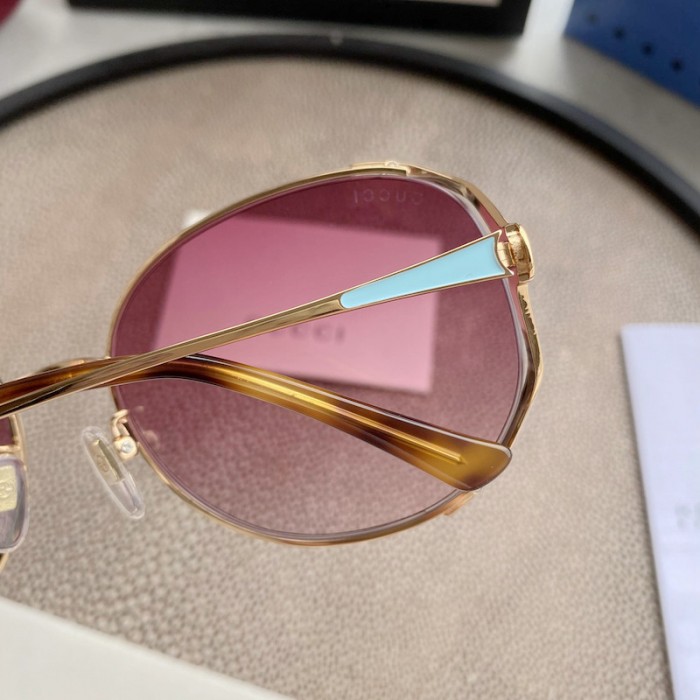 G*u*i oval metal sunglasses blue