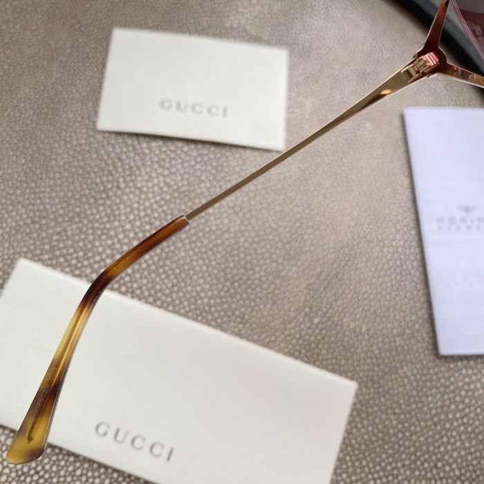 G*u*i oval metal sunglasses blue