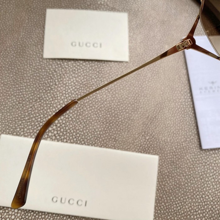 G*u*i oval metal sunglasses brown