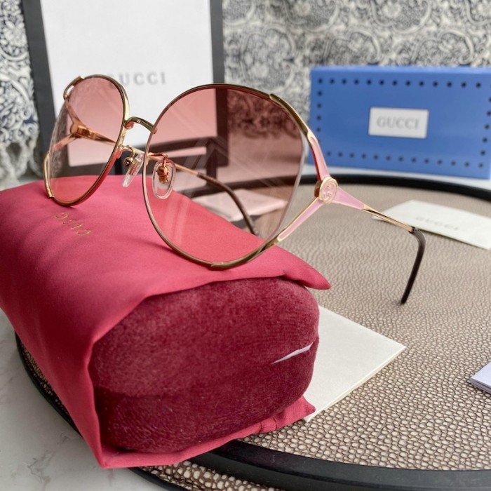 G*u*i oval metal sunglasses pink