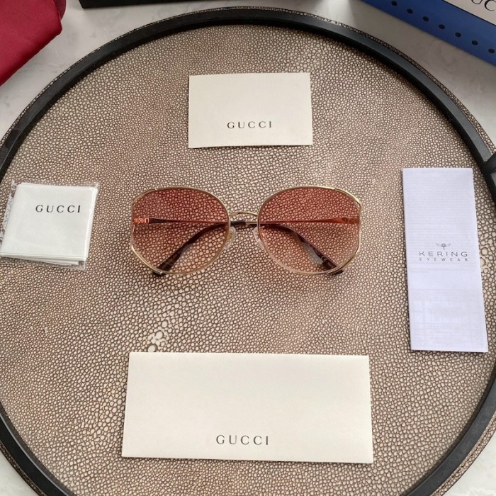 G*u*i oval metal sunglasses pink