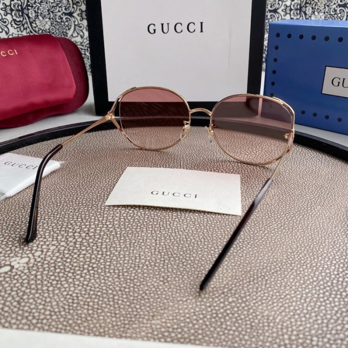 G*u*i oval metal sunglasses pink