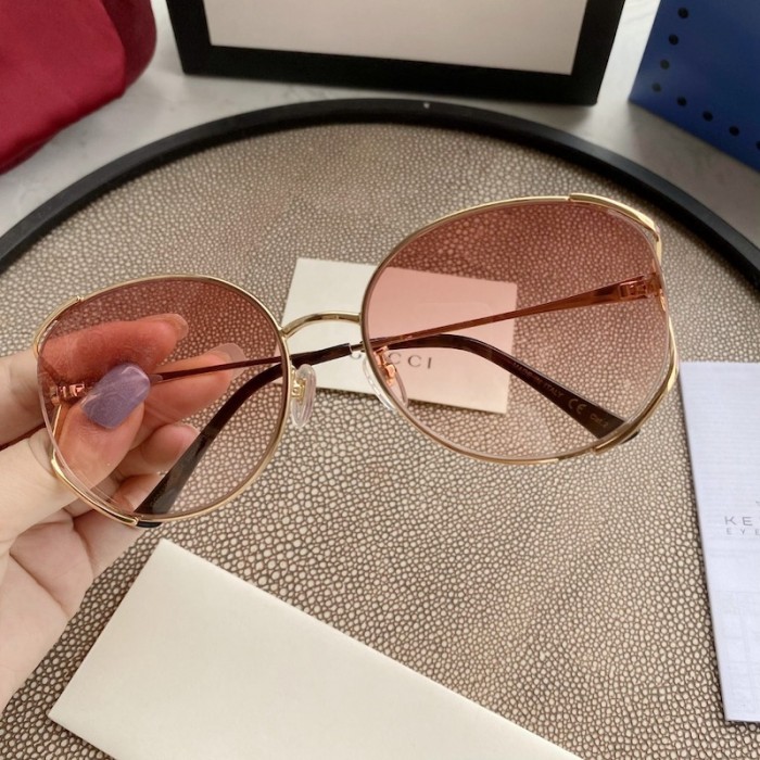 G*u*i oval metal sunglasses pink