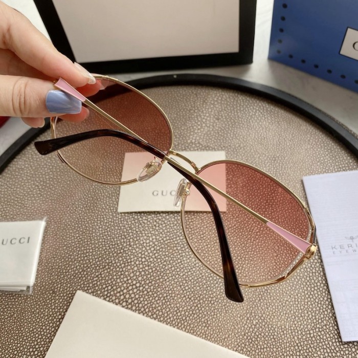 G*u*i oval metal sunglasses pink