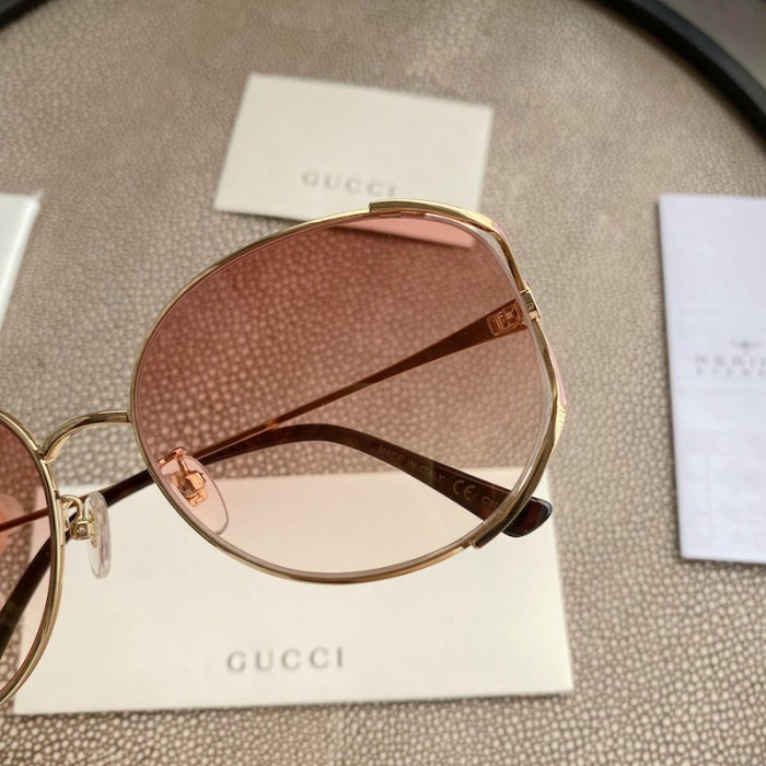 G*u*i oval metal sunglasses pink