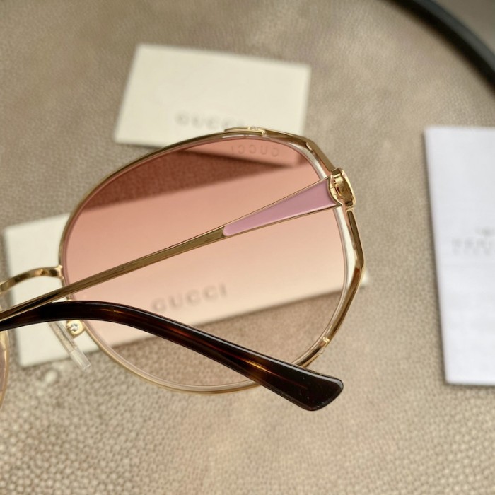G*u*i oval metal sunglasses pink