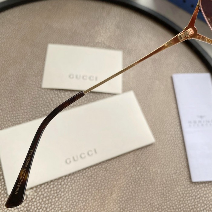 G*u*i oval metal sunglasses pink