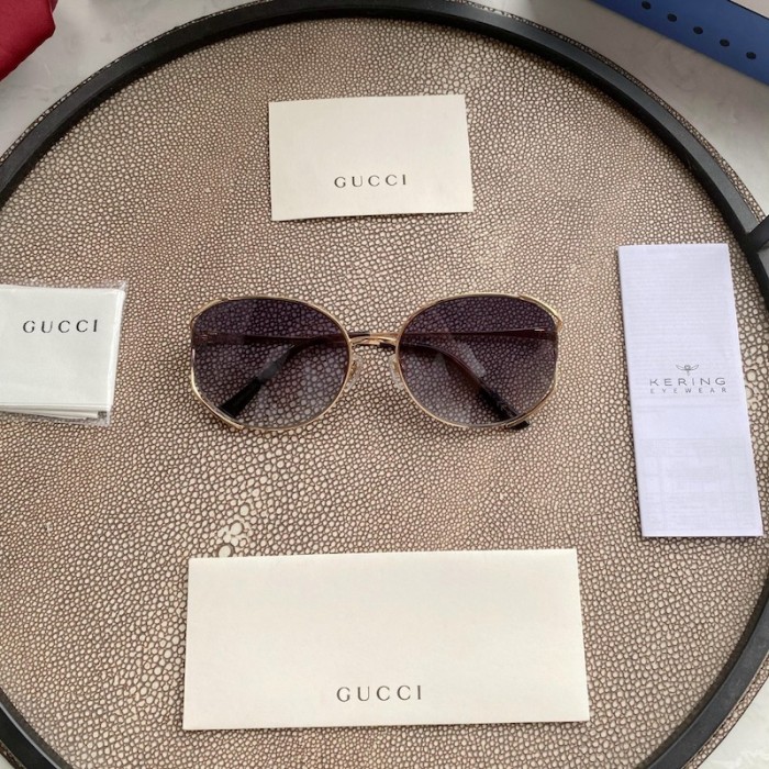 G*u*i oval metal sunglasses white