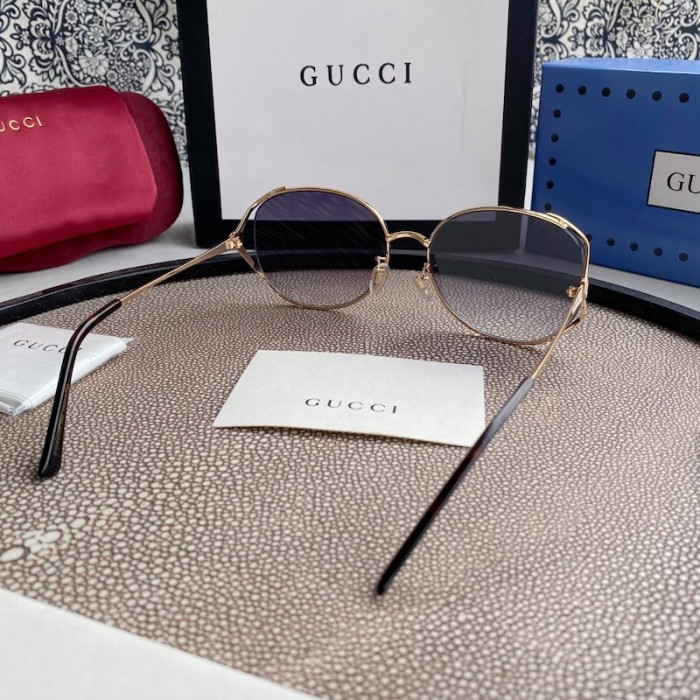 G*u*i oval metal sunglasses white