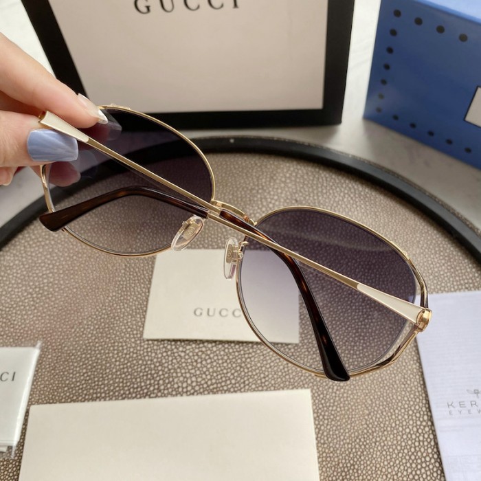G*u*i oval metal sunglasses white